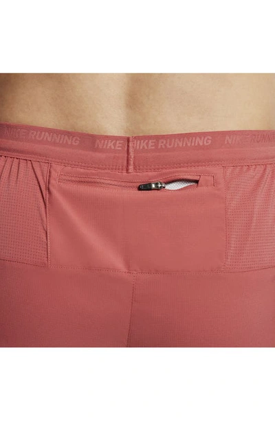 Shop Nike Dri-fit Stride 2-in-1 Running Shorts In Adobe/ Cedar/ Red Stardust