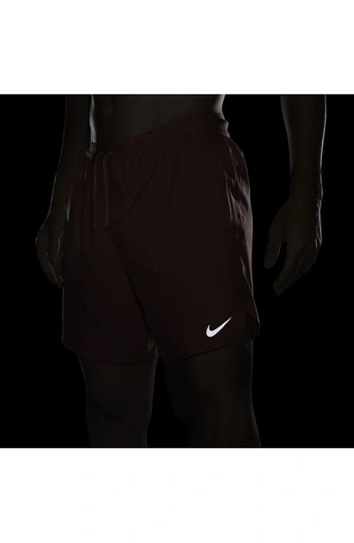 Shop Nike Dri-fit Stride 2-in-1 Running Shorts In Adobe/ Cedar/ Red Stardust