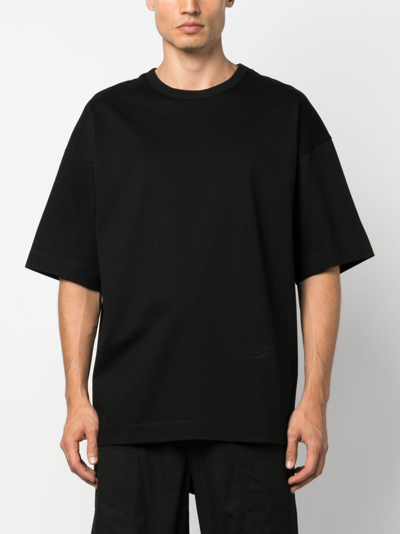 Shop Juunj Logo-embroidered Cotton T-shirt In Black