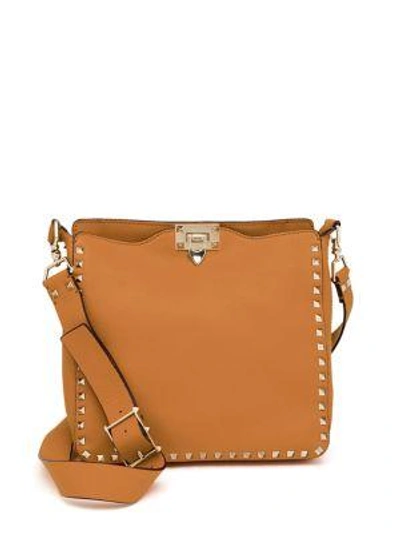 Shop Valentino Rockstud Utilitarian Small Leather Crossbody Bag In Poudre