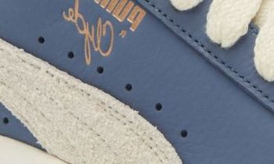 Shop Puma X Rhuigi Clyde Low Top Basketball Sneaker In Pristine-pristine-inky Blue