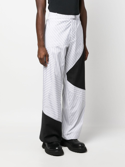 Shop Kiko Kostadinov Stripe-panelled Wide-leg Trousers In 灰色