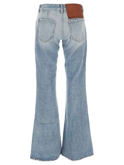 Shop Palm Angels Denim Bootcut Jeans In Blue