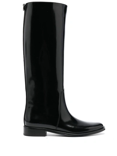 Shop Saint Laurent Hunt Patent Leather Boots In Black