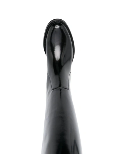 Shop Saint Laurent Hunt Patent Leather Boots In Black