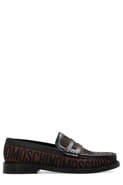 Shop Moschino Allover Logo Printed Loafers In Multi