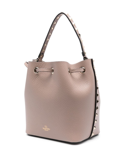 Shop Valentino Rockstud Leather Bucket Bag In Rosa