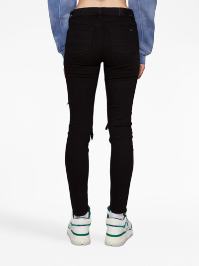 Shop Amiri Mx1 Low-rise Skinny Jeans In Schwarz