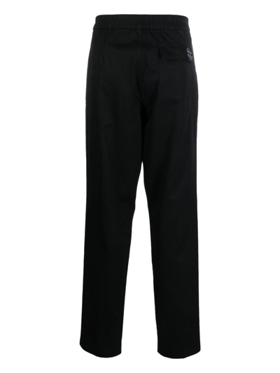 Shop Roberto Cavalli Logo-embroidered Cotton Trousers In Black