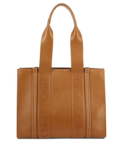 Shop Chloé "medium Woody" Tote Bag In Brown