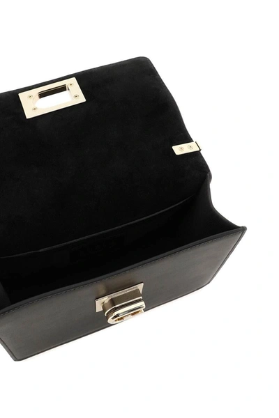 Shop Furla 1927 Mini Crossbody Bag In Black