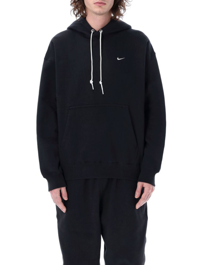 Shop Nike Solo Swoosh Logo Embroidered Hoodie In Black