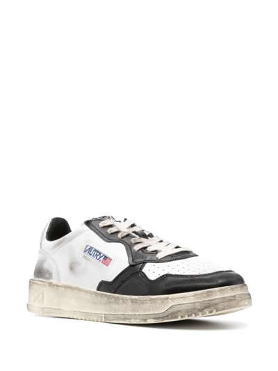 Shop Autry Super Vintage Leather Sneakers In White