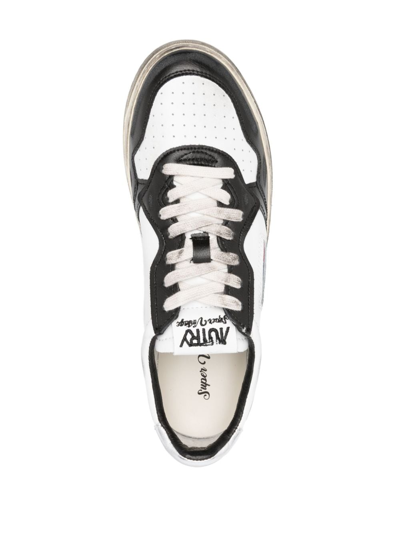 Shop Autry Super Vintage Leather Sneakers In White