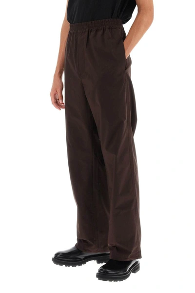 Shop Oamc 'dome' Straight Cut Pants In Brown