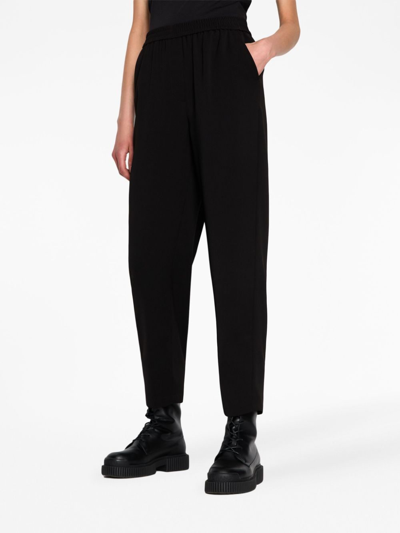 Shop Armani Exchange Cropped Tapered-leg Trousers In Schwarz