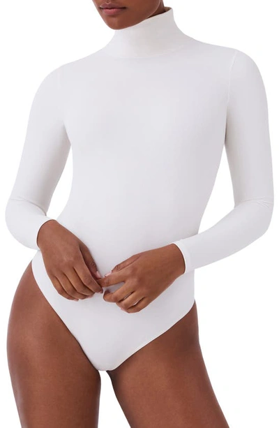 Shop Spanx Long Sleeve Smoother Thong Bodysuit In Parchment