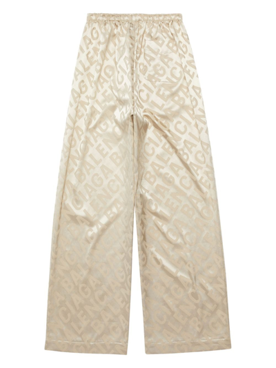 Shop Balenciaga Allover Logo Pajama Trousers In Neutrals