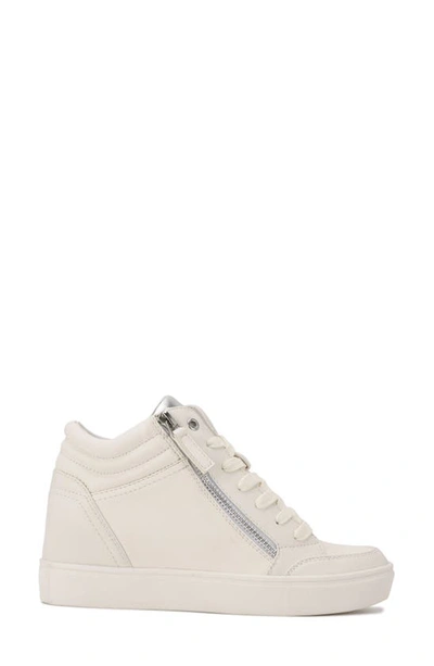 Shop Nine West Tons Lace-up Wedge Sneaker In White/ Silver