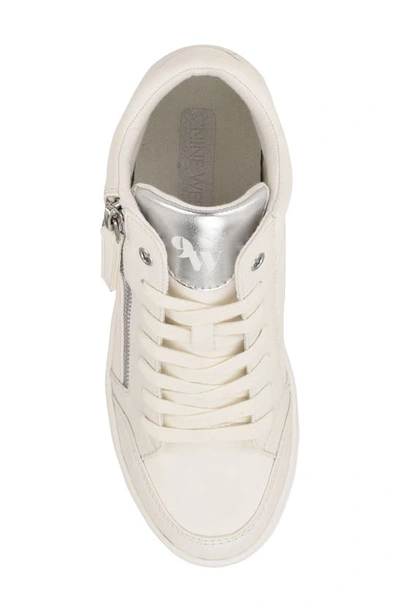 Shop Nine West Tons Lace-up Wedge Sneaker In White/ Silver