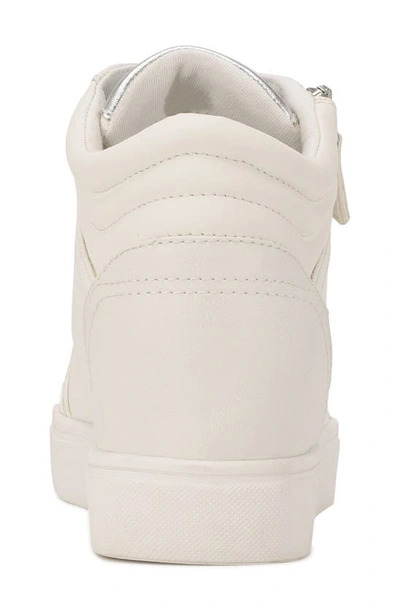 Shop Nine West Tons Lace-up Wedge Sneaker In White/ Silver