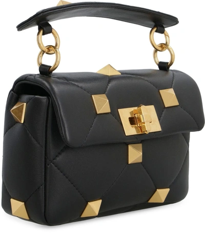 Shop Valentino Garavani - Roman Stud Leather Mini Crossbody Bag In Black