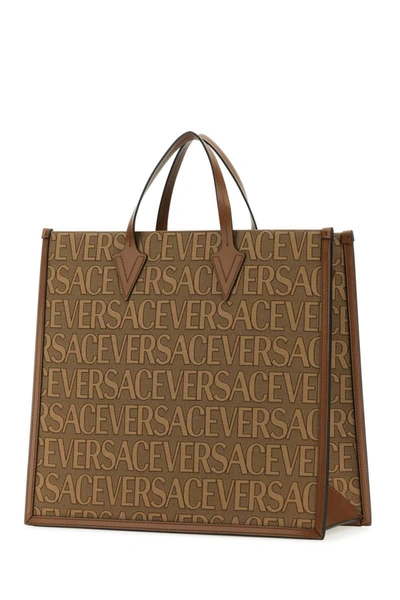 Shop Versace Handbags. In Printed