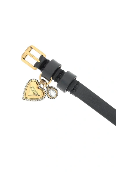 Shop Alexander Mcqueen Leather Bracelet With Heart Charm In Black