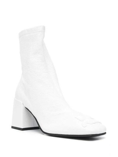 Shop Courrèges Boots In White