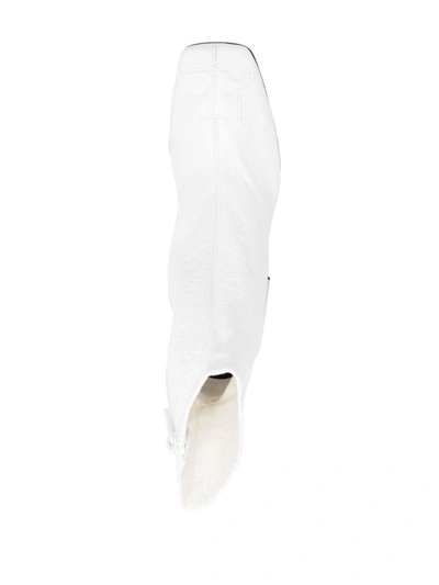Shop Courrèges Boots In White