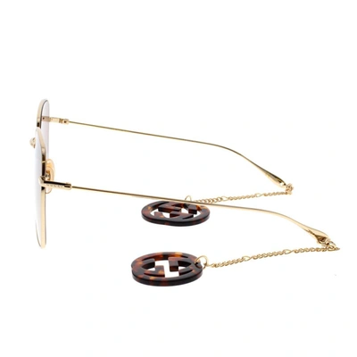 Shop Gucci Eyewear Sunglasses In Gold