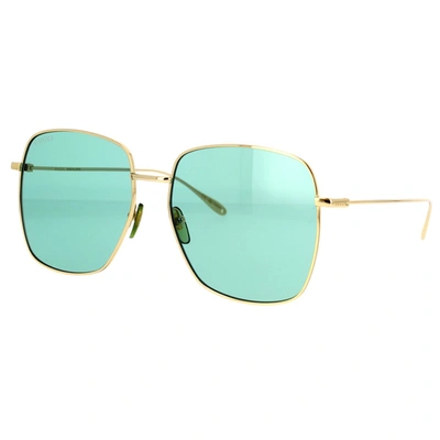 Shop Gucci Eyewear Sunglasses In Gold