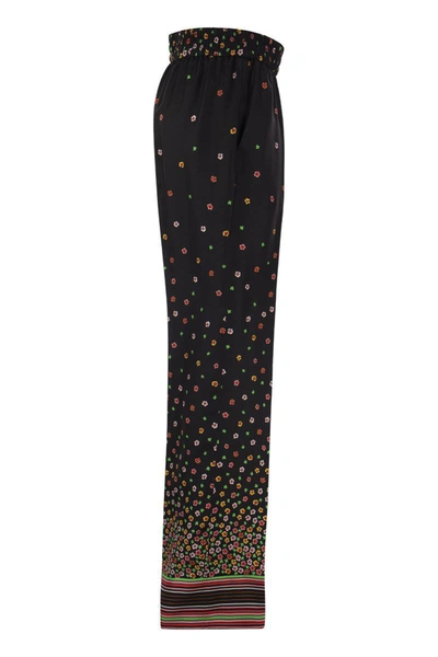 Shop Red Valentino Floral Print Silk Trousers In Black