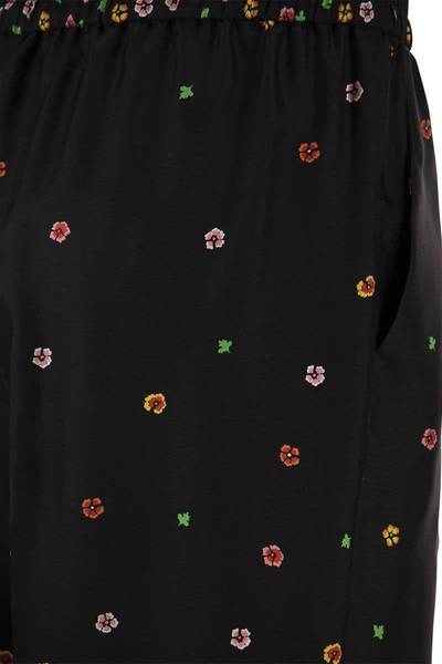 Shop Red Valentino Floral Print Silk Trousers In Black