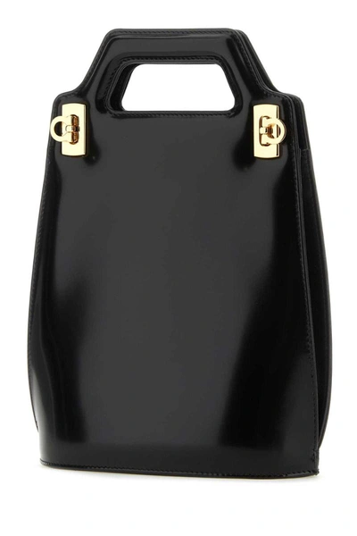 Shop Ferragamo Salvatore  Handbags. In Black