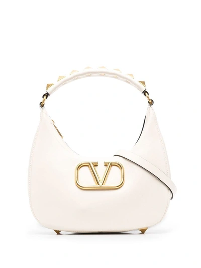 Shop Valentino Garavani Stud Sign Leather Hobo Bag In White