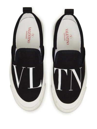 Shop Valentino Garavani Vltn Canvas Slip On In Black