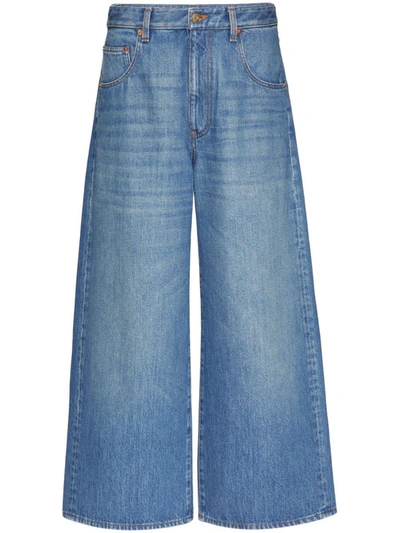 Shop Valentino Vlogo Chain Wide-leg Jeans In Blue