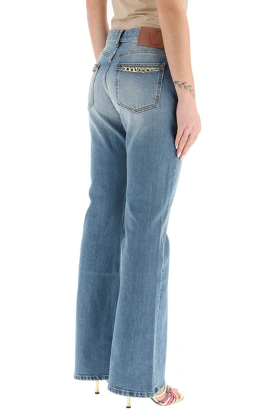 Shop Valentino Vlogo Chain Flared Jeans In Blue