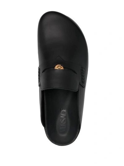 Shop Versace Leather Mules In Black