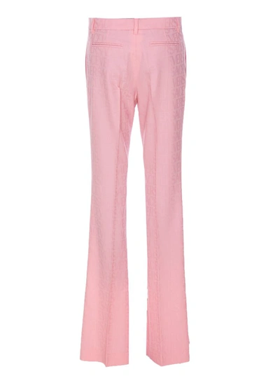Shop Versace Trousers In Pink