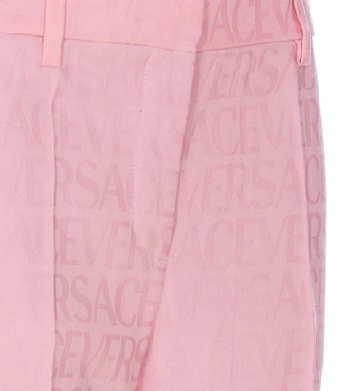 Shop Versace Trousers In Pink