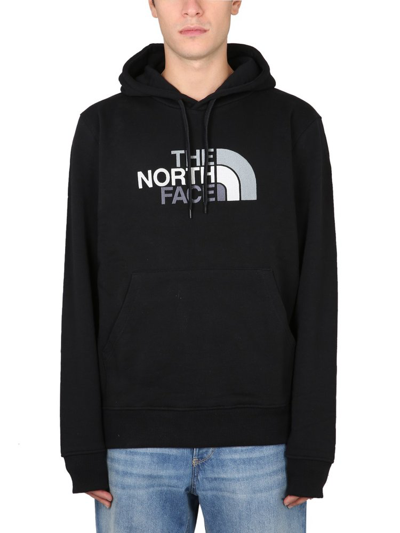Shop The North Face Logo Printed Drawstring Hoodie In Black
