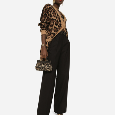 Shop Dolce & Gabbana Flared Wool Pants With Logo Tag In Black