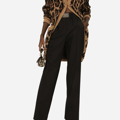Dolce & Gabbana Flared Wool Pants With Logo Tag In Black