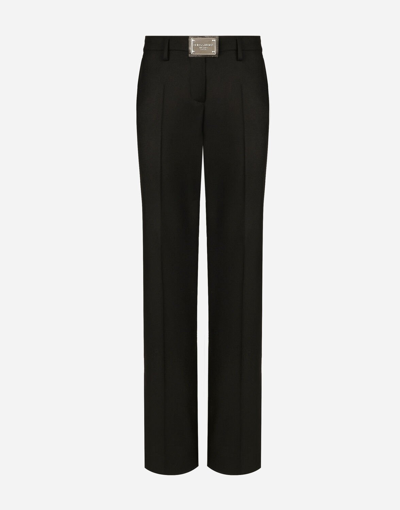Shop Dolce & Gabbana Flared Flannel Pants With Logo Tag In Black