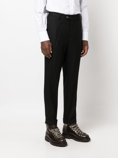 Brunello Cucinelli Pinstripe-pattern Virgin-wool Trousers In Schwarz