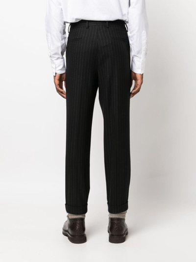 Brunello Cucinelli Pinstripe-pattern Virgin-wool Trousers In Schwarz
