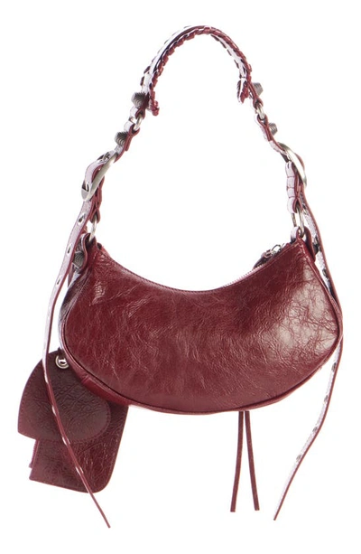 Shop Balenciaga Extra Small Le Cagole Lambskin Shoulder Bag In Brick Red