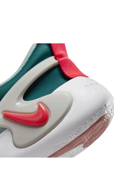 Shop Nike Kids' Dynamo Go Sneaker In Jade/ Siren Red/ Geode Teal